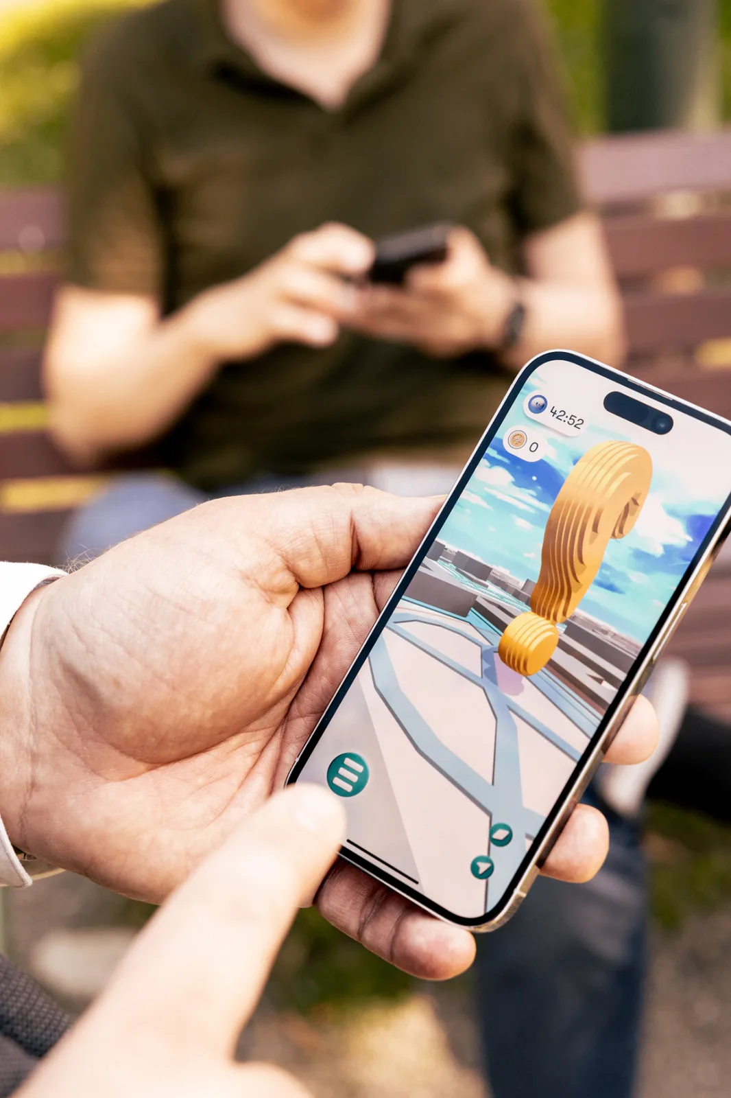 Audience member holding a phone with a fully branded activation experience on screen